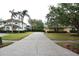 Spacious driveway leading to single-Gathering homes in a landscaped neighborhood at 19109 Beckett Dr, Odessa, FL 33556