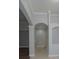 Bright entryway featuring tile flooring, architectural arches, and neutral paint scheme at 19109 Beckett Dr, Odessa, FL 33556