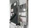 Photograph of two gray HVAC units with ductwork and labels attached to the sides at 19109 Beckett Dr, Odessa, FL 33556