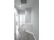 Hallway featuring wood-style flooring and neutral paint at 19109 Beckett Dr, Odessa, FL 33556