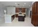 Open-concept kitchen with large island, modern appliances, and abundant cabinet space at 19109 Beckett Dr, Odessa, FL 33556