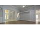 Bright, open living space with decorative ceilings, accent walls, and stylish flooring at 19109 Beckett Dr, Odessa, FL 33556