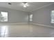 Spacious living room with tiled floors and plenty of natural light offers a versatile living space at 19109 Beckett Dr, Odessa, FL 33556