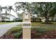 Mailbox with address in landscaped neighborhood, with home in the background at 19109 Beckett Dr, Odessa, FL 33556