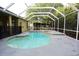 Screened-in pool and spa are the perfect backyard oasis for relaxation and entertainment at 19109 Beckett Dr, Odessa, FL 33556