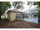 View of screened-in pool area with pool, patio, and side view of home at 19109 Beckett Dr, Odessa, FL 33556
