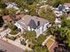 Stunning aerial view of a stately home with manicured landscaping and mature trees in a desirable neighborhood at 200 Grand Blvd, Tarpon Springs, FL 34689