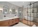 Modern bathroom with double vanity, frameless glass shower enclosure, soaking tub, and stylish tile work at 200 Grand Blvd, Tarpon Springs, FL 34689