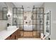Modern bathroom featuring a sleek vanity, frameless glass shower enclosure, and a luxurious soaking tub at 200 Grand Blvd, Tarpon Springs, FL 34689