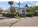 Beautiful home with a striking facade, well-maintained lawn, and mature palm trees at 200 Grand Blvd, Tarpon Springs, FL 34689