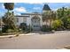 Elegant home with unique architectural details, grand entrance, and lush landscaping at 200 Grand Blvd, Tarpon Springs, FL 34689