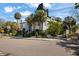 A uniquely designed house featuring black and white accents, landscaped grounds and mature trees on a corner lot at 200 Grand Blvd, Tarpon Springs, FL 34689