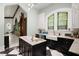 Spacious kitchen with marble countertops, stainless steel appliances, and stained glass windows at 200 Grand Blvd, Tarpon Springs, FL 34689
