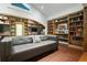 Inviting living room with built-in bookshelves and an arched study nook creates a cozy and functional space at 200 Grand Blvd, Tarpon Springs, FL 34689