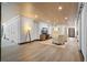 Relaxing living room features a stylish accent wall, two comfortable chairs, and a modern entertainment center at 200 Grand Blvd, Tarpon Springs, FL 34689
