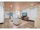 Relaxing living room features a stylish accent wall, two comfortable chairs, and a modern entertainment center at 200 Grand Blvd, Tarpon Springs, FL 34689