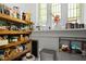 Pantry with abundant storage shelves filled with various food items and containers at 200 Grand Blvd, Tarpon Springs, FL 34689