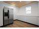 Butlers pantry with ample counter space, custom cabinets, and stainless steel refrigerator at 200 Grand Blvd, Tarpon Springs, FL 34689
