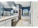Bathroom offers dual sinks, bathtub, and walk-in shower for a luxurious experience at 22129 Yachtclub Ter, Land O Lakes, FL 34639
