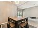 Dining area featuring a wooden table with seating for four, with an open space to the living room for gathering at 22129 Yachtclub Ter, Land O Lakes, FL 34639