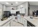 Bright kitchen with white cabinetry and modern stainless steel appliances at 22129 Yachtclub Ter, Land O Lakes, FL 34639