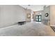 Spacious living room featuring plush carpet, neutral walls, and elegant archways, creating a cozy atmosphere at 22129 Yachtclub Ter, Land O Lakes, FL 34639