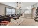 Cozy living room showcases ample seating and natural light from large windows at 22129 Yachtclub Ter, Land O Lakes, FL 34639