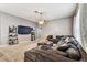 Inviting living room with stylish decor, large TV, and comfortable seating arrangement at 22129 Yachtclub Ter, Land O Lakes, FL 34639