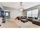 Comfortable living room features plush seating, ceiling fan, and neutral decor at 22129 Yachtclub Ter, Land O Lakes, FL 34639
