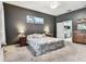 Comfortable main bedroom with neutral walls, plush carpet, and ensuite bathroom at 22129 Yachtclub Ter, Land O Lakes, FL 34639