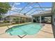 Screened-in pool featuring a beautiful pool, patio area, and view of the backyard and neighboring houses at 22129 Yachtclub Ter, Land O Lakes, FL 34639