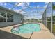 Screened-in pool area featuring a beautiful pool and a view of the lake at 22129 Yachtclub Ter, Land O Lakes, FL 34639