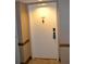 Condo front door with unit number, decorative knocker, and secure lock system at 2333 Feather Sound Dr # A208, Clearwater, FL 33762
