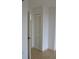 Hallway with tile floors leads to closet at 2333 Feather Sound Dr # A208, Clearwater, FL 33762