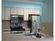 Kitchen featuring stainless appliances, tile backsplash and tiled countertops at 2333 Feather Sound Dr # A208, Clearwater, FL 33762