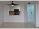 Open-concept living room view into the kitchen area of the home at 2333 Feather Sound Dr # A208, Clearwater, FL 33762