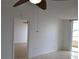 Living room features tile flooring, ceiling fan, and access to balcony at 2333 Feather Sound Dr # A208, Clearwater, FL 33762