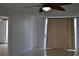 Living room features tile flooring, ceiling fan, and access to balcony at 2333 Feather Sound Dr # A208, Clearwater, FL 33762