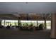 Large lobby featuring a seating area, chandelier, and many potted plants at 2333 Feather Sound Dr # A208, Clearwater, FL 33762