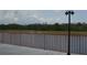 Scenic view of a pond from a bridge featuring a brown metal railing at 2333 Feather Sound Dr # A208, Clearwater, FL 33762