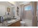 Charming bathroom with granite countertop vanity, decorative seahorse and bright window with shower/tub combo at 2375 Fairskies Dr, Spring Hill, FL 34606