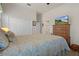 Bedroom with a comfortable bed, dresser with TV, and a closet at 2375 Fairskies Dr, Spring Hill, FL 34606