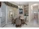 Bright breakfast nook with access to the patio, chandelier, and wet bar at 2375 Fairskies Dr, Spring Hill, FL 34606