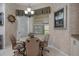 Cozy breakfast nook with a chandelier, seating for four, and natural light at 2375 Fairskies Dr, Spring Hill, FL 34606