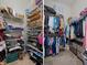 Walk-in closet features wire shelving and rods to maximize clothing and shoe storage at 2375 Fairskies Dr, Spring Hill, FL 34606