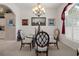 Bright dining room with chandelier, decorative window, and open to other living spaces at 2375 Fairskies Dr, Spring Hill, FL 34606