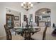 Bright dining area with chandelier lighting, and open views of the kitchen and living spaces at 2375 Fairskies Dr, Spring Hill, FL 34606