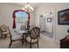 Elegant dining room showcasing chandelier lighting, decorative window, and entry to the home at 2375 Fairskies Dr, Spring Hill, FL 34606