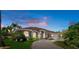 Beautiful single-story home with a paved driveway and well-manicured landscaping at 2375 Fairskies Dr, Spring Hill, FL 34606