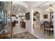 Elegant hallway with arched doorways leading to the living room and dining area at 2375 Fairskies Dr, Spring Hill, FL 34606